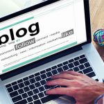 A person typing on a laptop with the word " blog " written in front of them.
